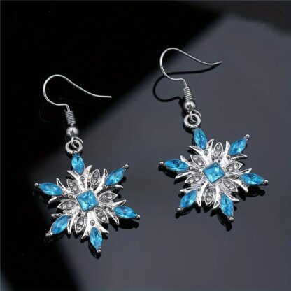 Enticing Snowflake Earrings: Shimmering Silver with Icy Blue Crystals