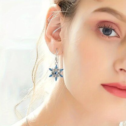 Enticing Snowflake Earrings: Shimmering Silver with Icy Blue Crystals - Image 3