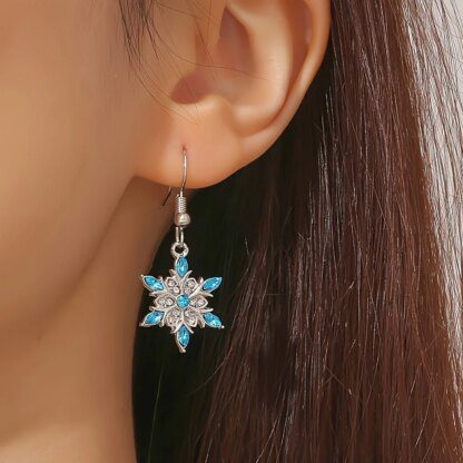 Enticing Snowflake Earrings: Shimmering Silver with Icy Blue Crystals - Image 2